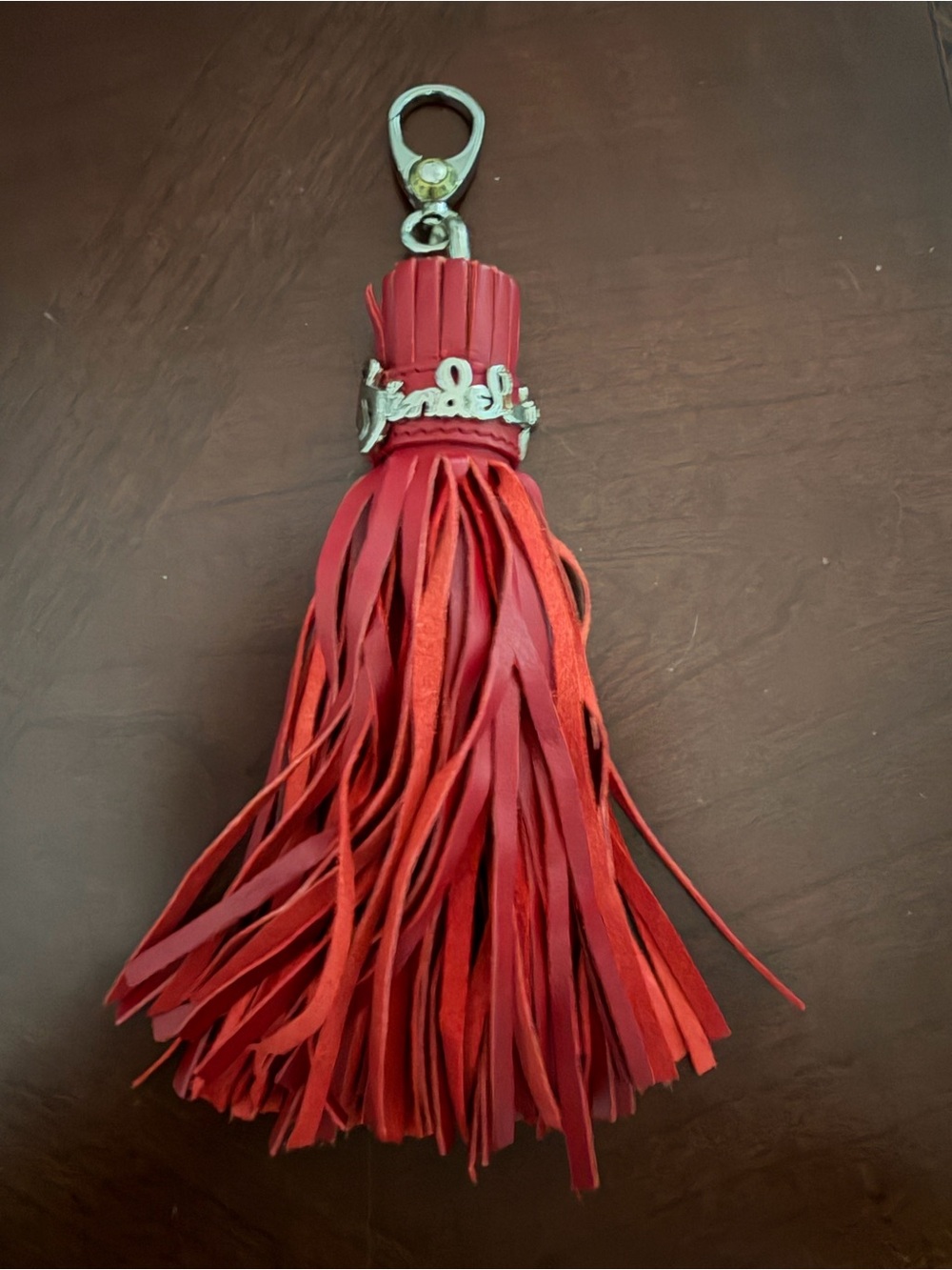 Henri Bendel Red Leather Tassel Bag Charm with Iconic Silver Script Logo